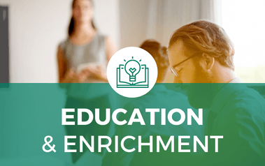 Education and Enrichment - image of people sitting at a table 