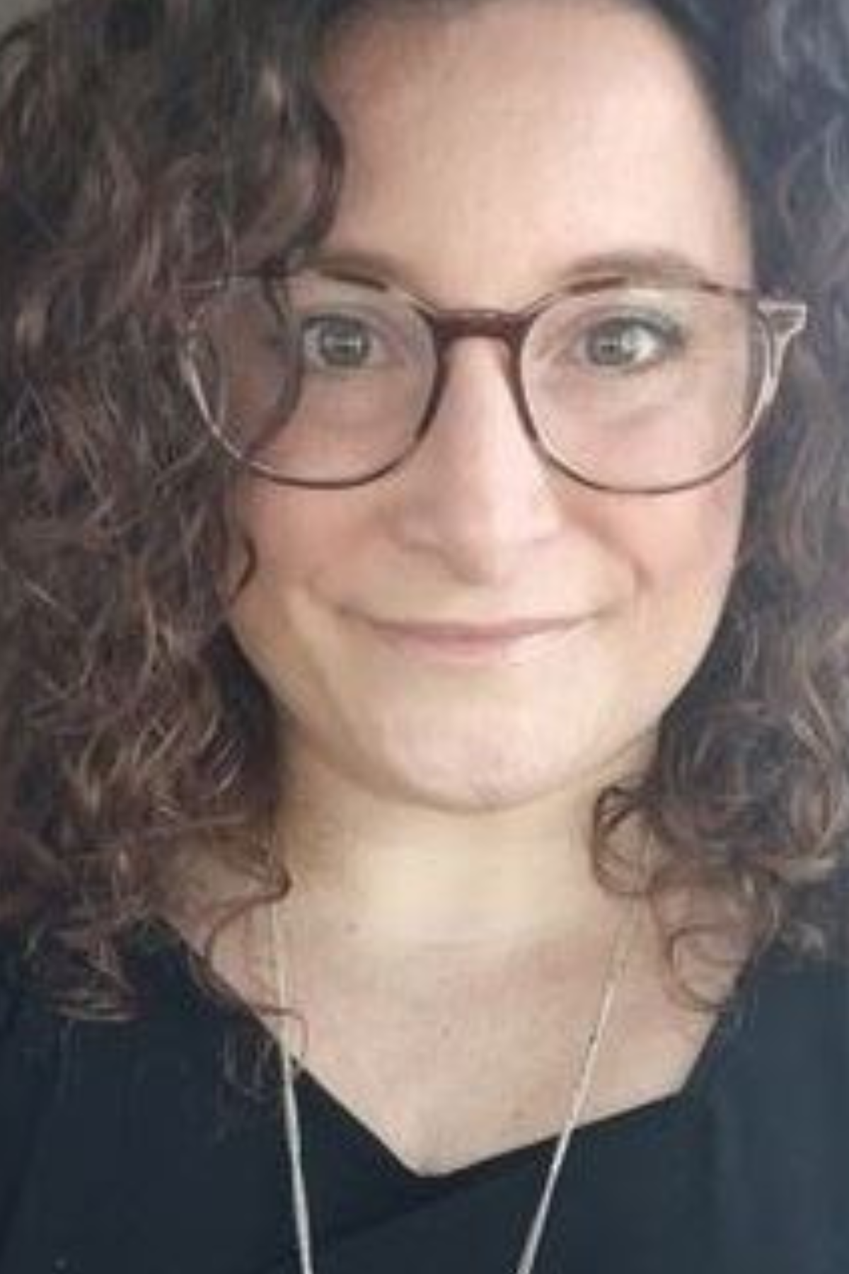 photo of staff member - selfie style in a car