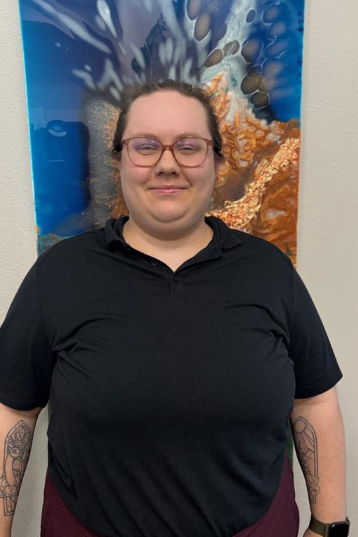 photo of a staff person standing in an office