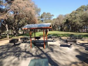 Covered Center counter, picnic tables, outdoor grills